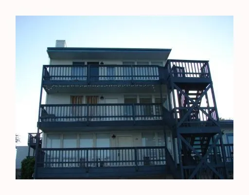 a view of a balcony with a iron stairs