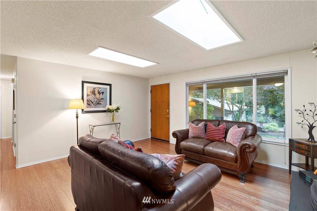 20915 West Richmond Road Bothell, WA 98021 - Photo 7 of 26 a living room with furniture and a window