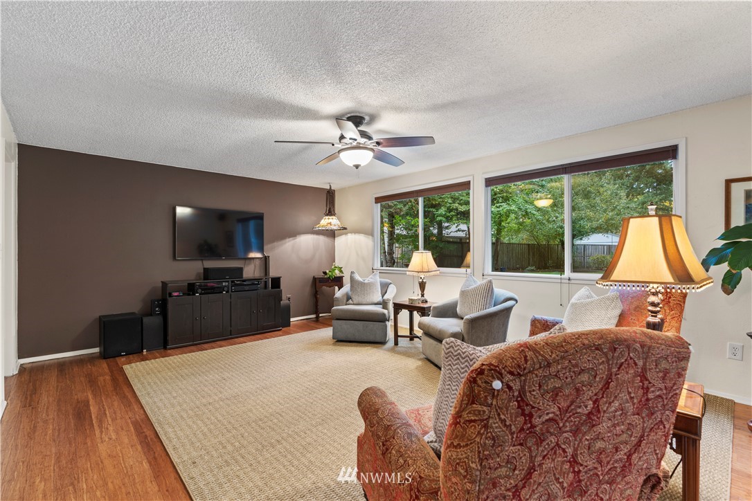 20915 West Richmond Road Bothell, WA 98021 - Photo 8 of 26 a living room with furniture and a flat screen tv