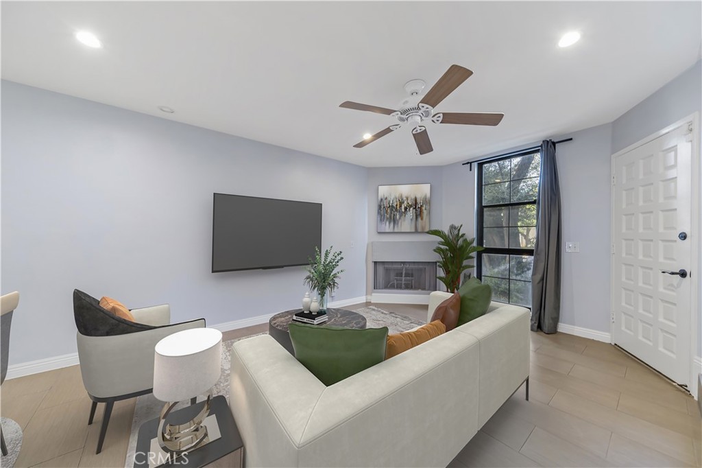 1426 Everton Place Riverside, CA 92507 - Photo 1 of 1 a living room with furniture and a flat screen tv