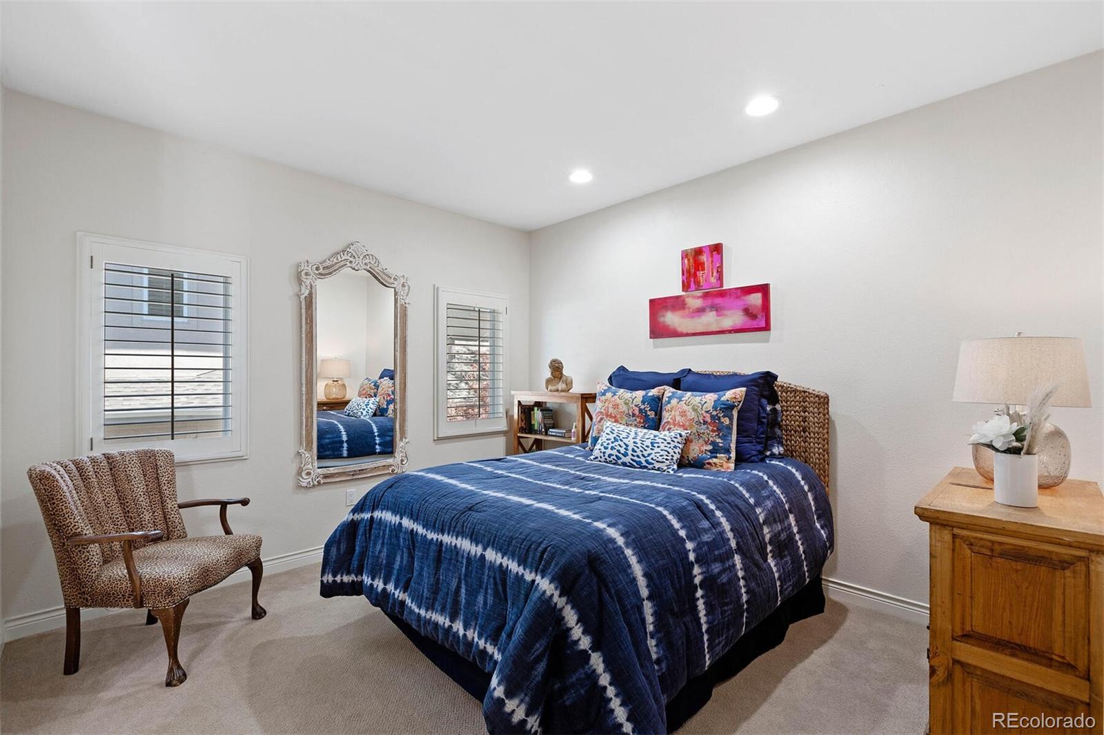 167 Monroe Street Denver, CO 80206 - Photo 24 of 39 a bedroom with a bed and a couch