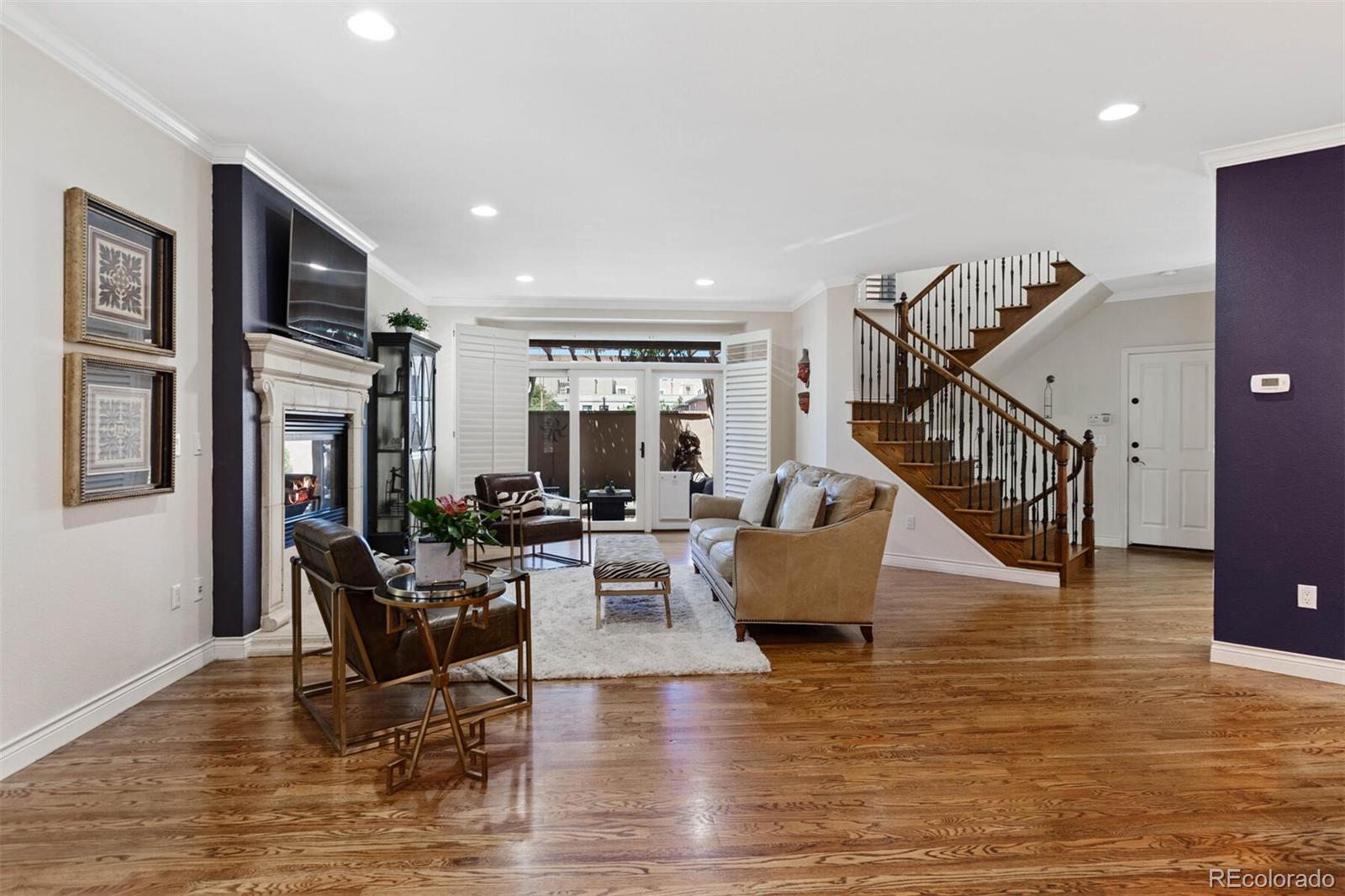 167 Monroe Street Denver, CO 80206 - Photo 3 of 39 a living room with furniture and a wooden floor