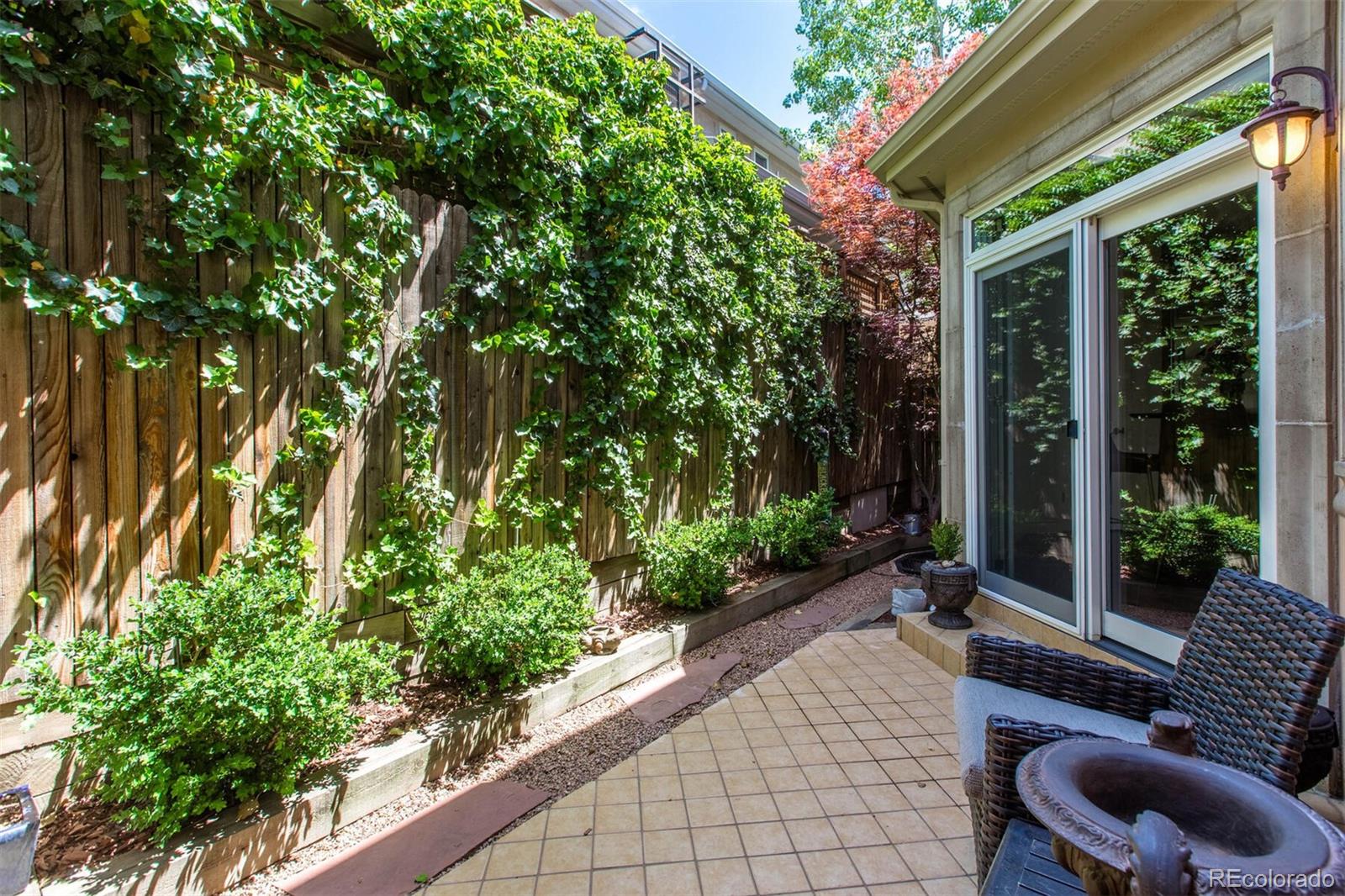 167 Monroe Street Denver, CO 80206 - Photo 35 of 39 a garden view with a seating space