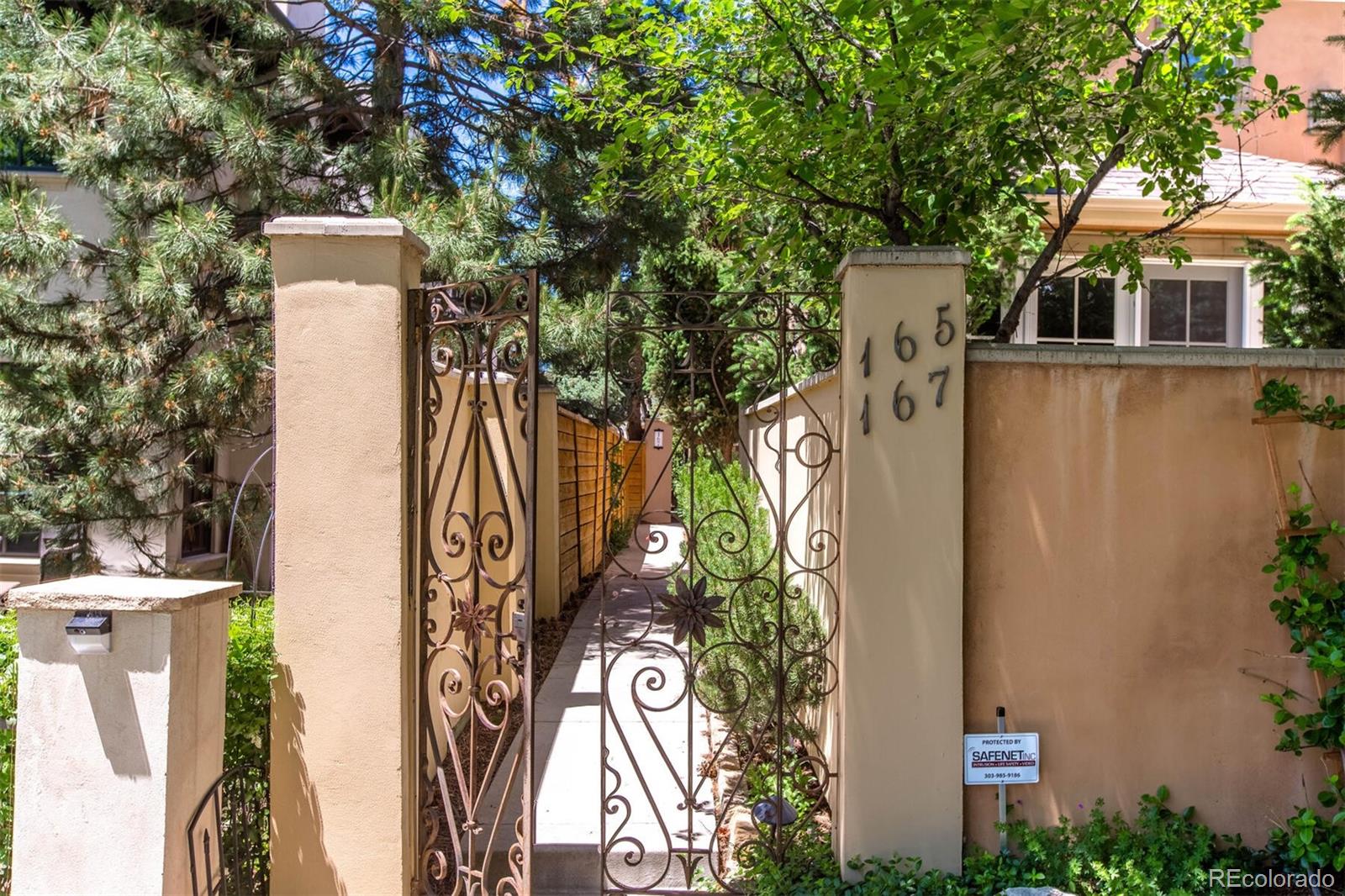 167 Monroe Street Denver, CO 80206 - Photo 36 of 39 front view of a house with a tree