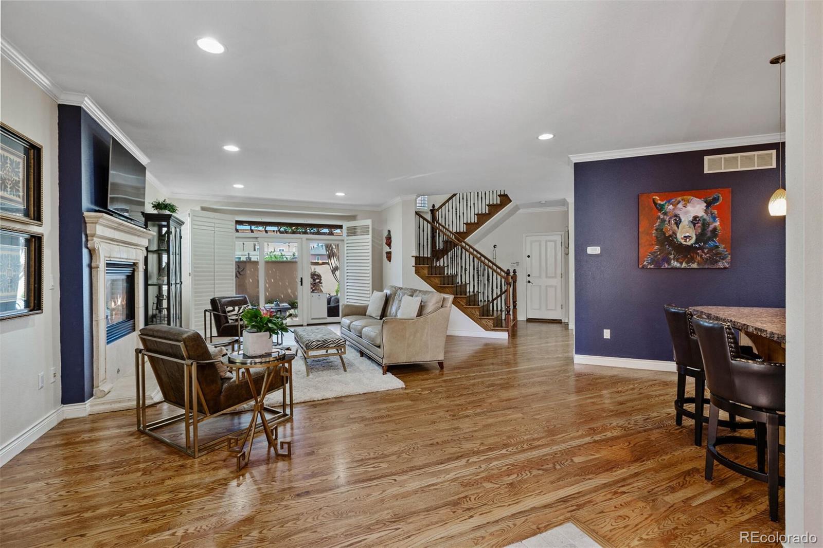 167 Monroe Street Denver, CO 80206 - Photo 4 of 39 a living room with furniture and a flat screen tv