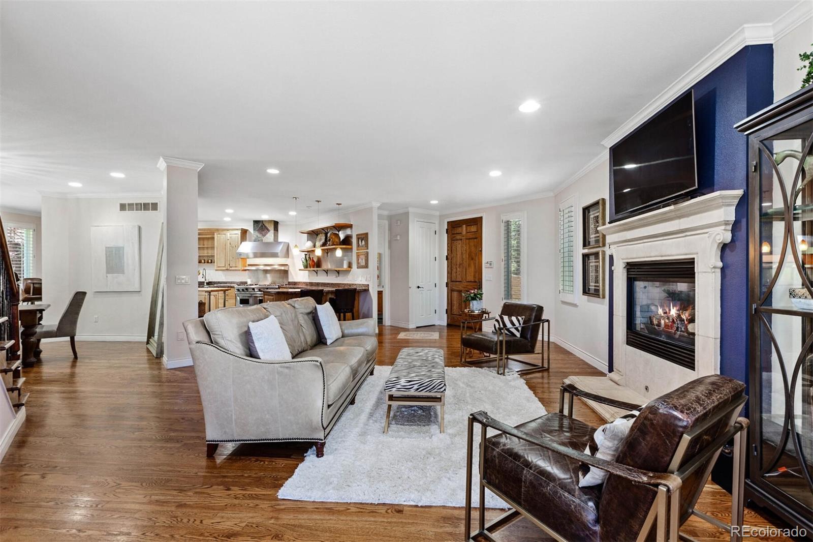 167 Monroe Street Denver, CO 80206 - Photo 6 of 39 a living room with furniture and a fireplace