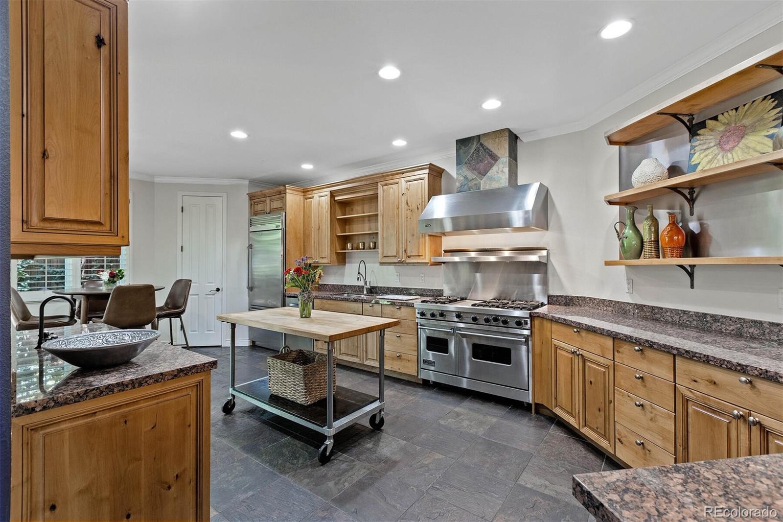 167 Monroe Street Denver, CO 80206 - Photo 10 of 39 a kitchen with a stove and a sink