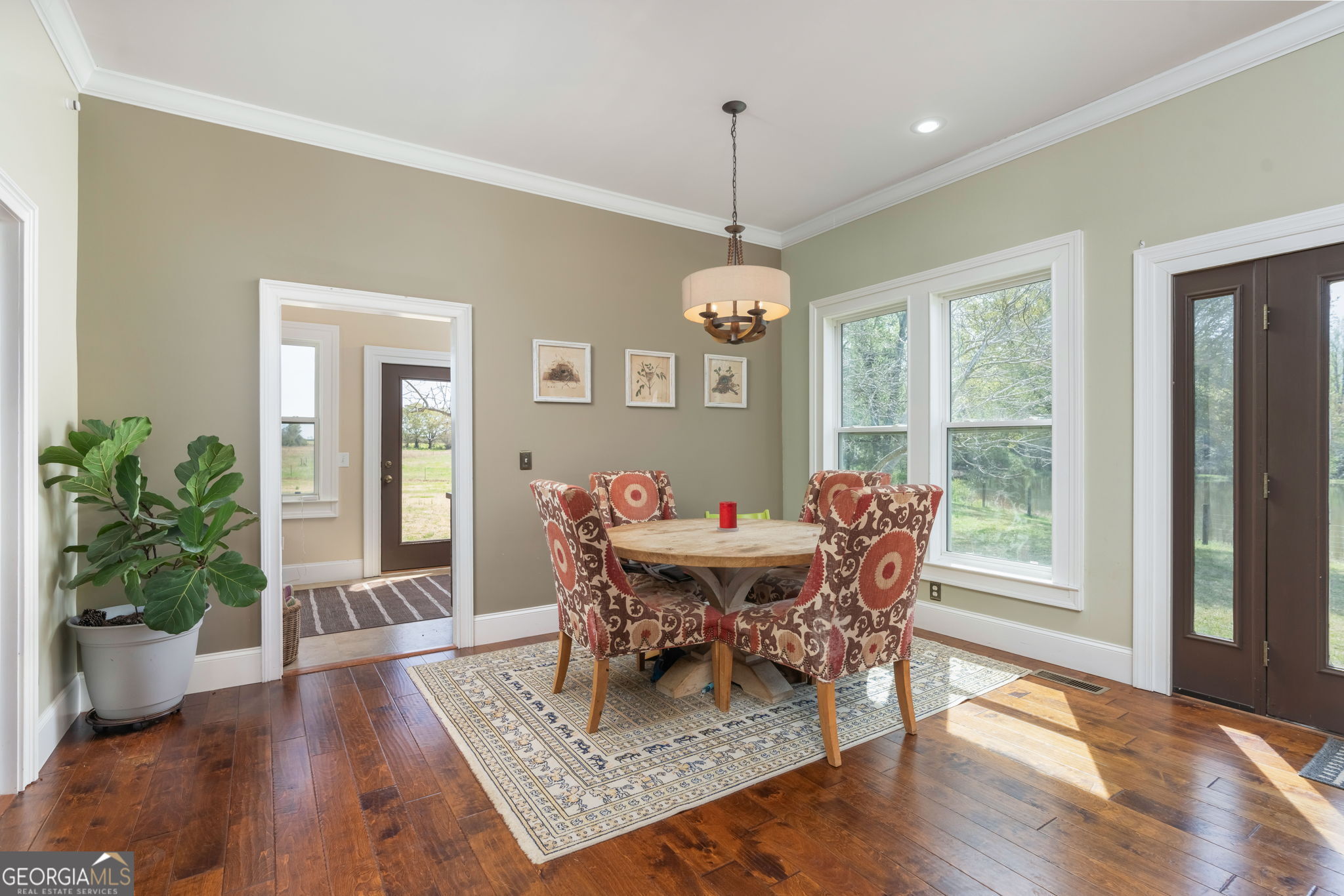 1725 Watermelon Road Tennille, GA 31089 - Photo 13 of 55 a view of a dining room with furniture window and wooden floor