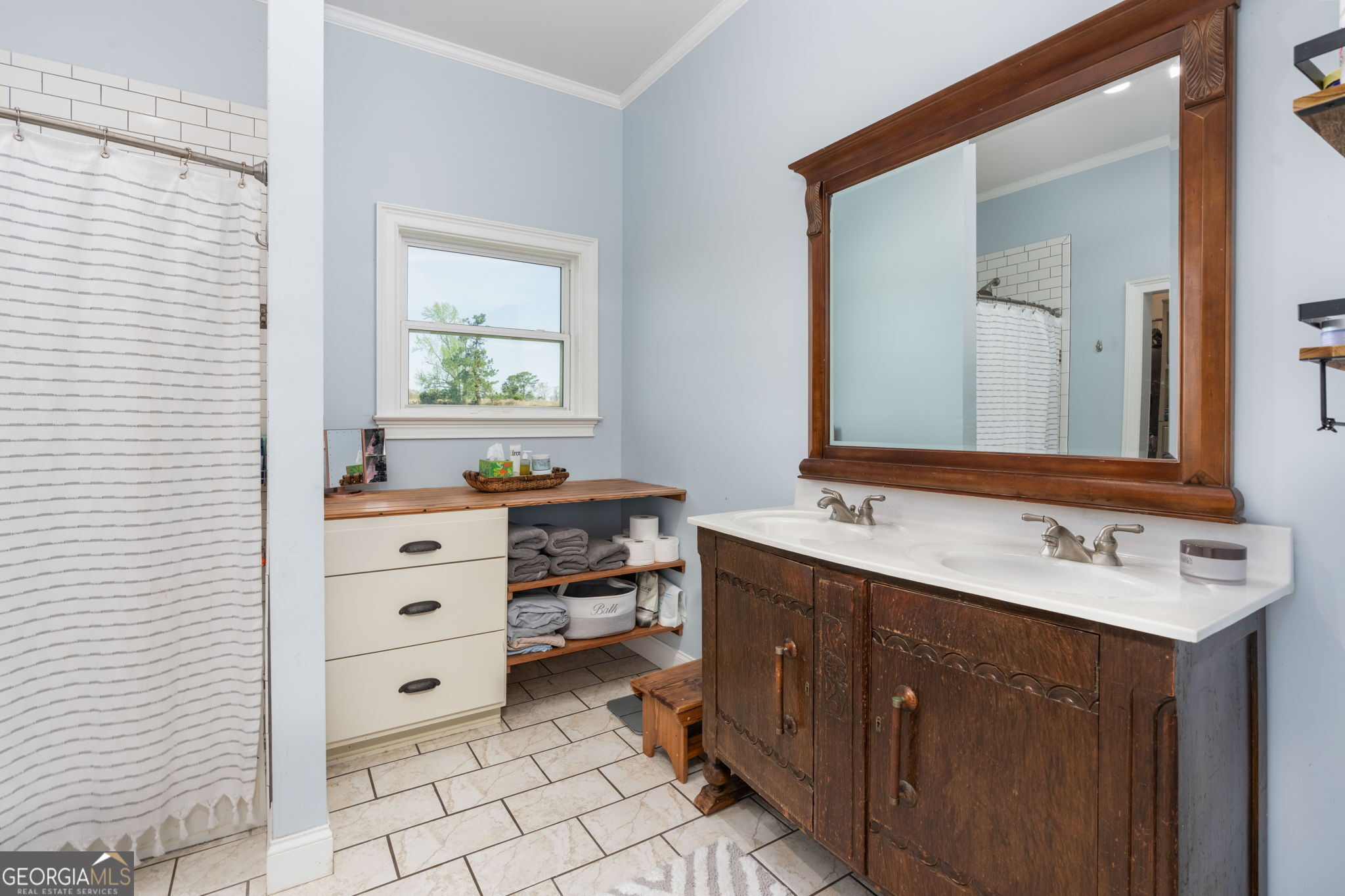 1725 Watermelon Road Tennille, GA 31089 - Photo 17 of 55 a bathroom with a sink vanity and mirror