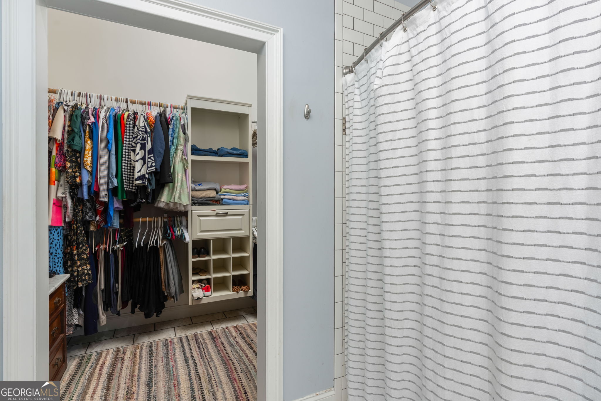 1725 Watermelon Road Tennille, GA 31089 - Photo 19 of 55 a view of walk in closet with clothes and shoes