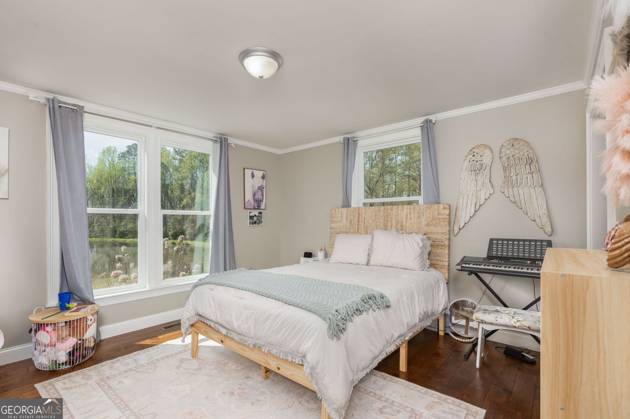 1725 Watermelon Road Tennille, GA 31089 - Photo 20 of 55 a bedroom with a bed and a window