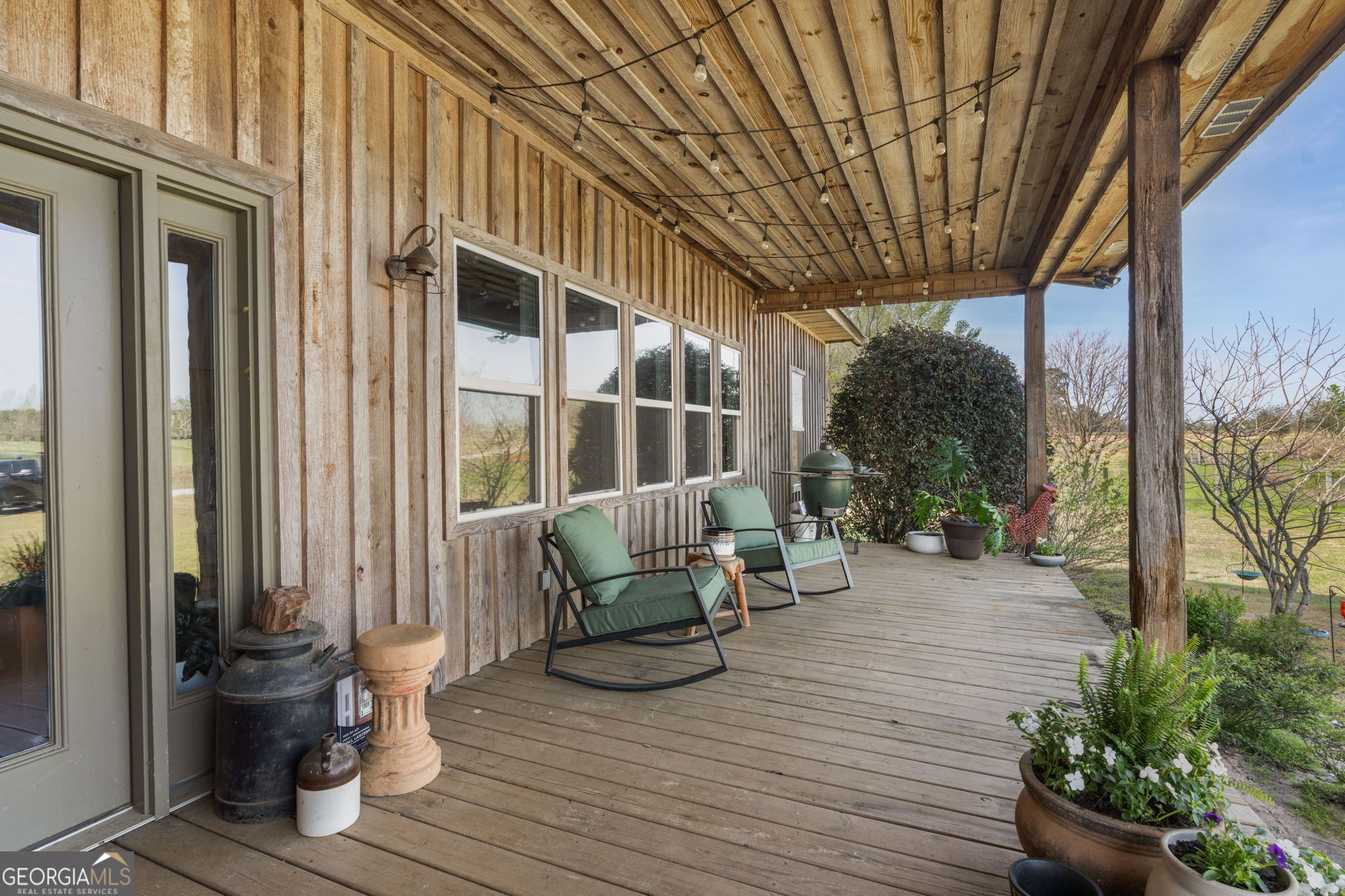 1725 Watermelon Road Tennille, GA 31089 - Photo 2 of 55 a view of balcony with chairs and wooden fence