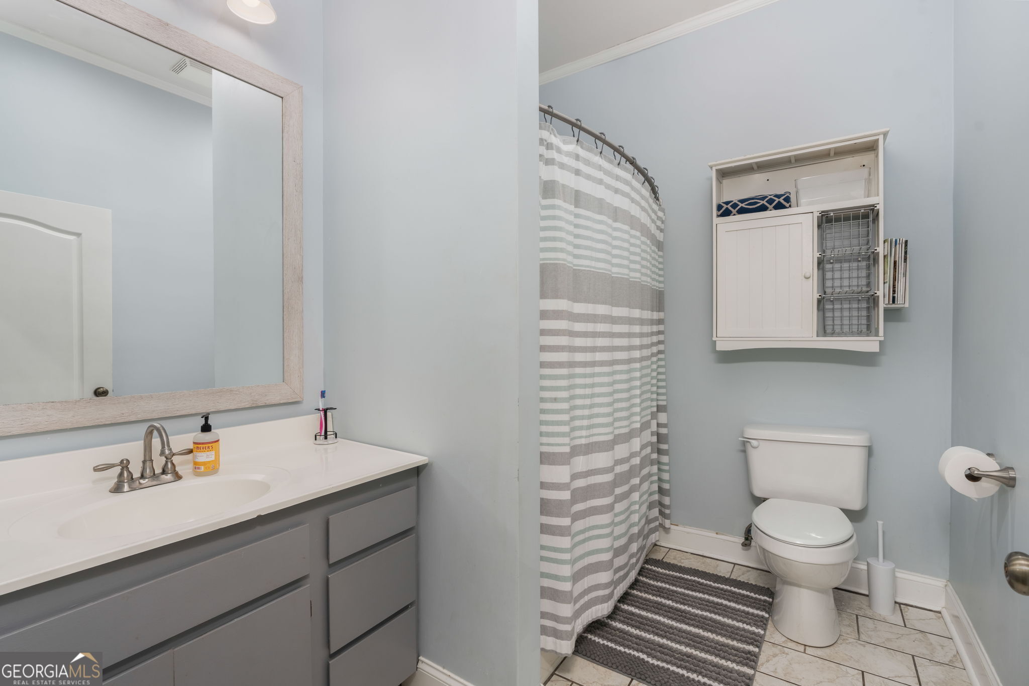 1725 Watermelon Road Tennille, GA 31089 - Photo 22 of 55 a bathroom with a sink toilet and shower