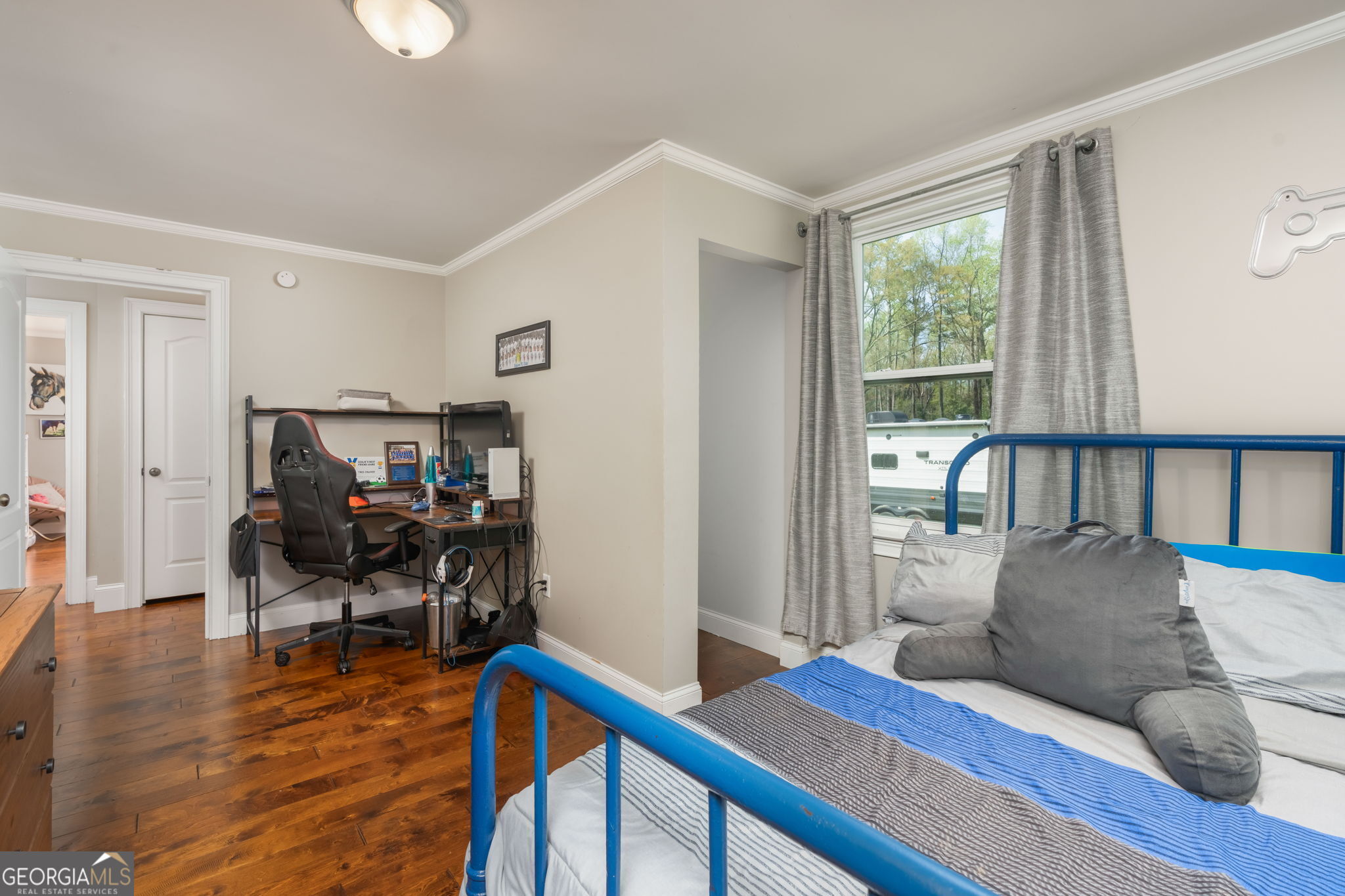 1725 Watermelon Road Tennille, GA 31089 - Photo 24 of 55 a living room with furniture and a wooden floor