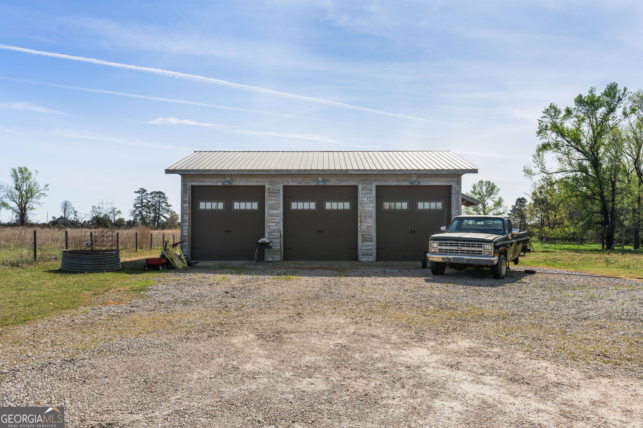 1725 Watermelon Road Tennille, GA 31089 - Photo 27 of 55 a house view with a garden space