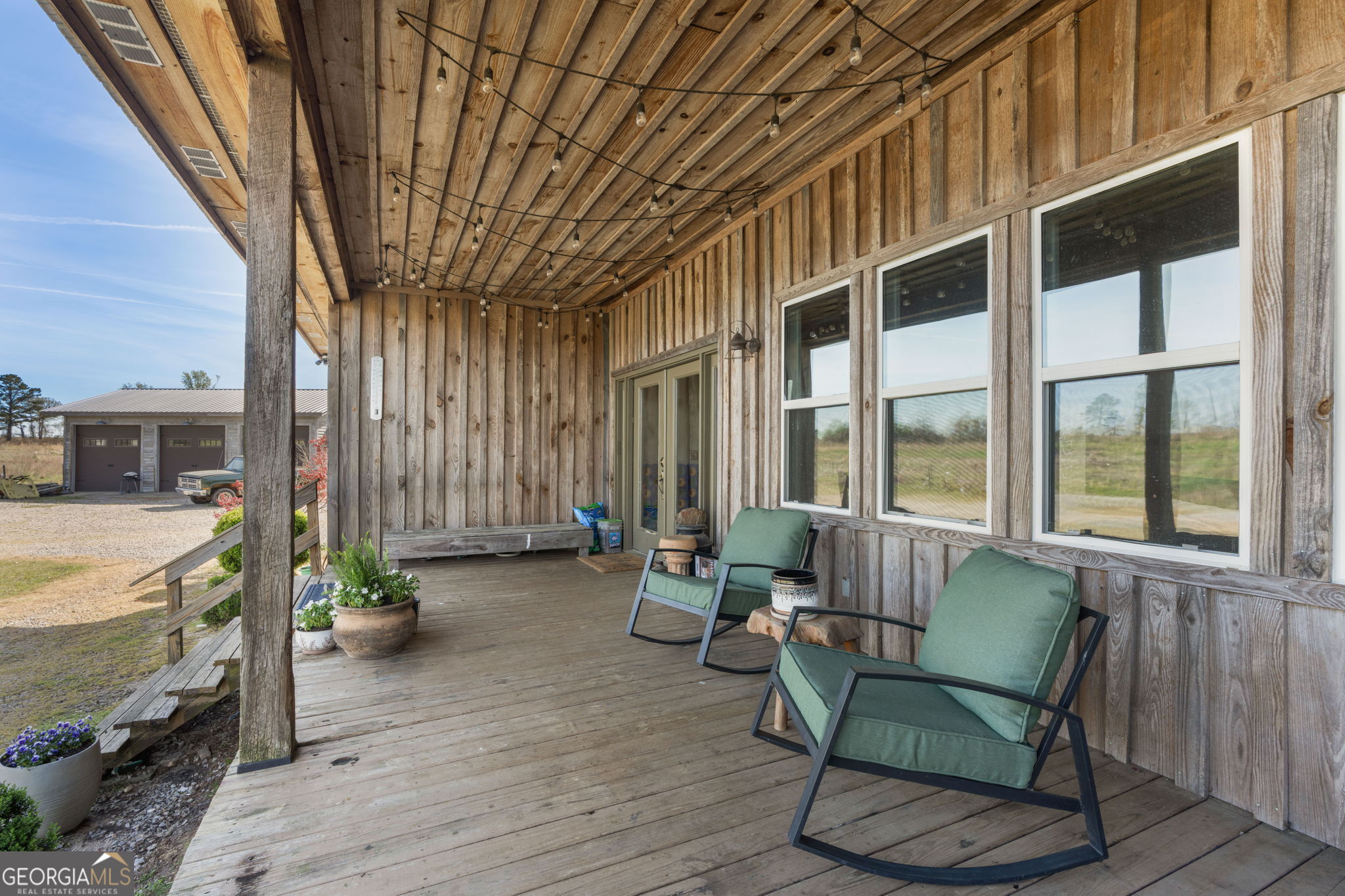 1725 Watermelon Road Tennille, GA 31089 - Photo 3 of 55 a balcony with furniture and large windows