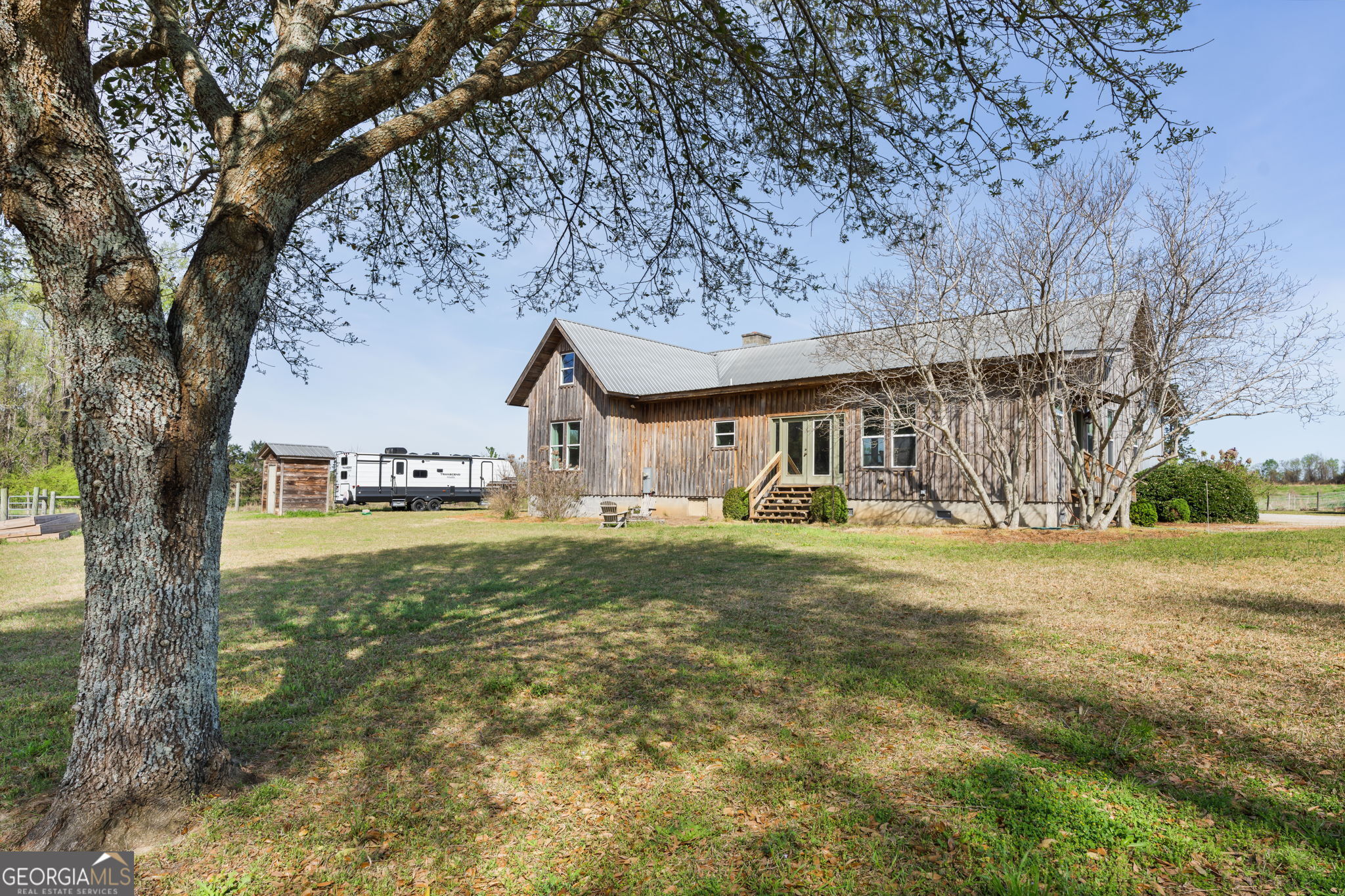 1725 Watermelon Road Tennille, GA 31089 - Photo 34 of 55 a front view of a house with garden
