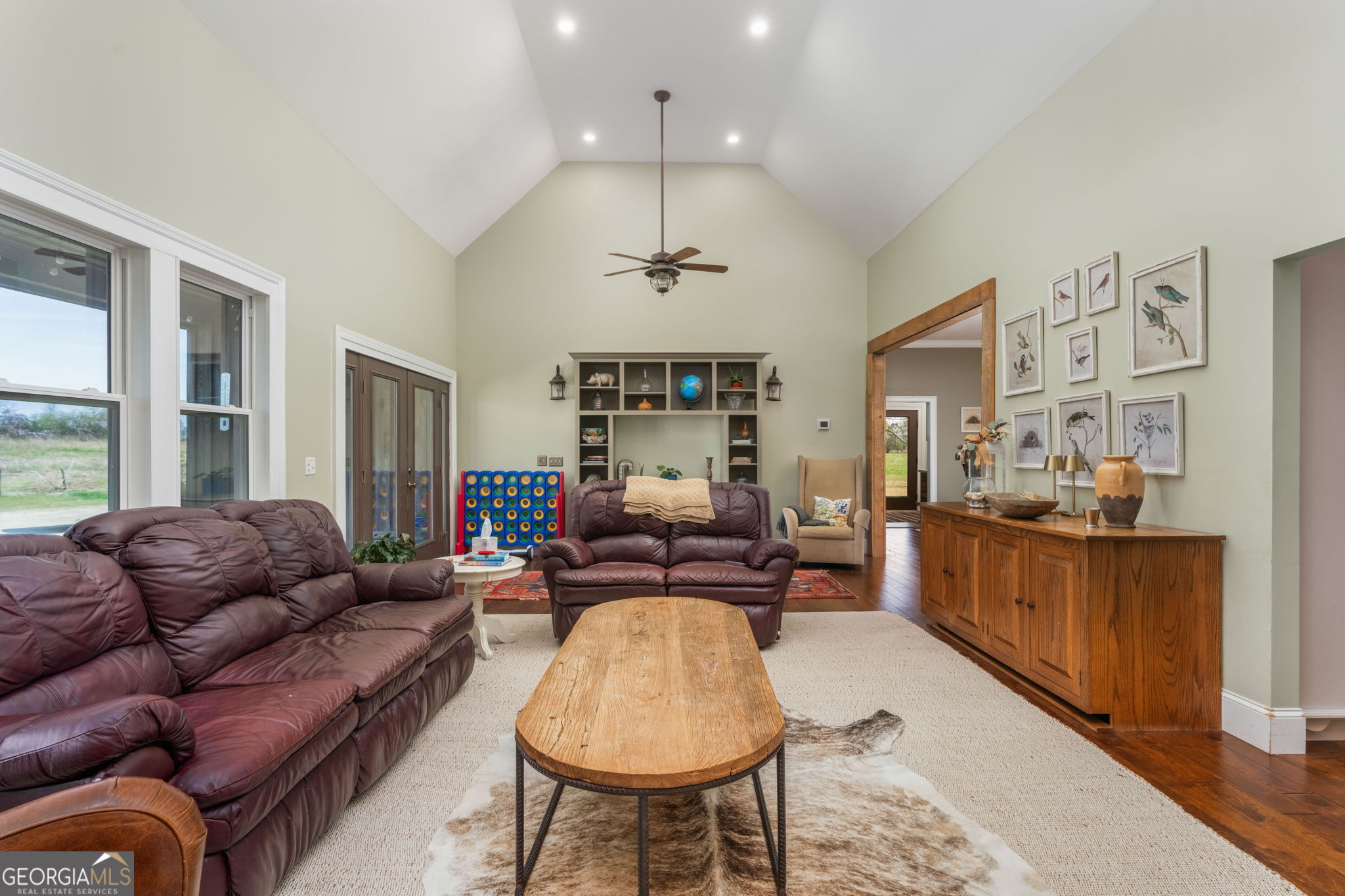 1725 Watermelon Road Tennille, GA 31089 - Photo 7 of 55 a living room with furniture a chandelier and a chandelier