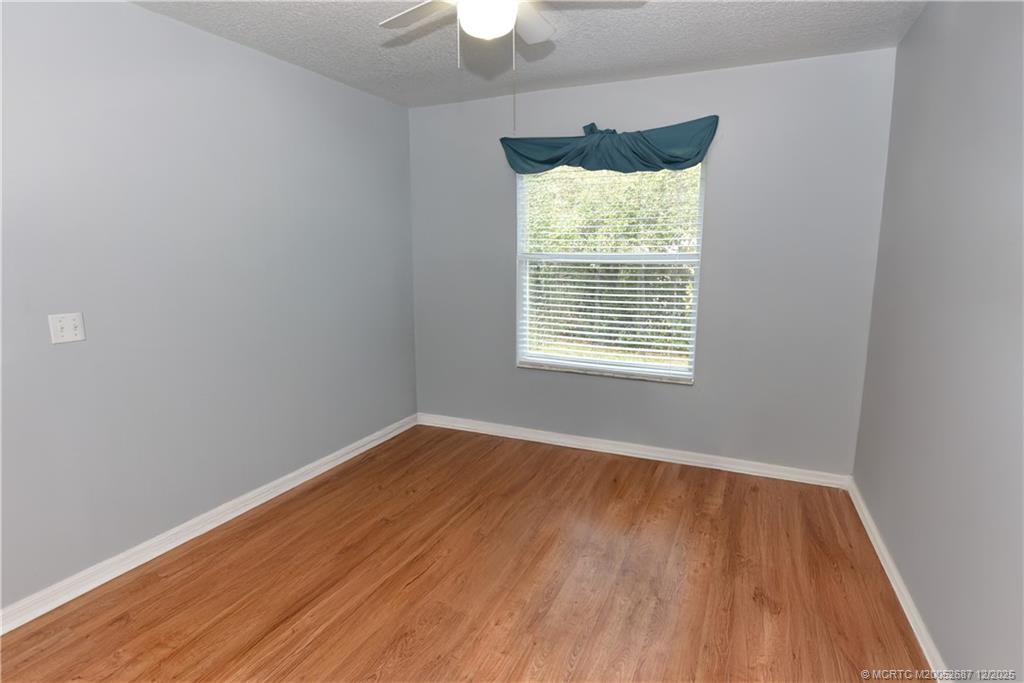 5374 Southeast Running Oak Circle Stuart, FL 34997 - Photo 22 of 38 an empty room with a window