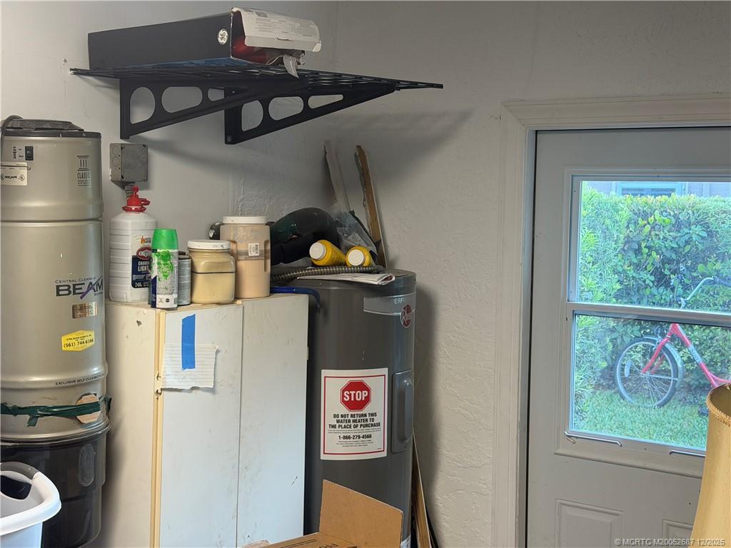 5374 Southeast Running Oak Circle Stuart, FL 34997 - Photo 25 of 38 a room with storage and utility