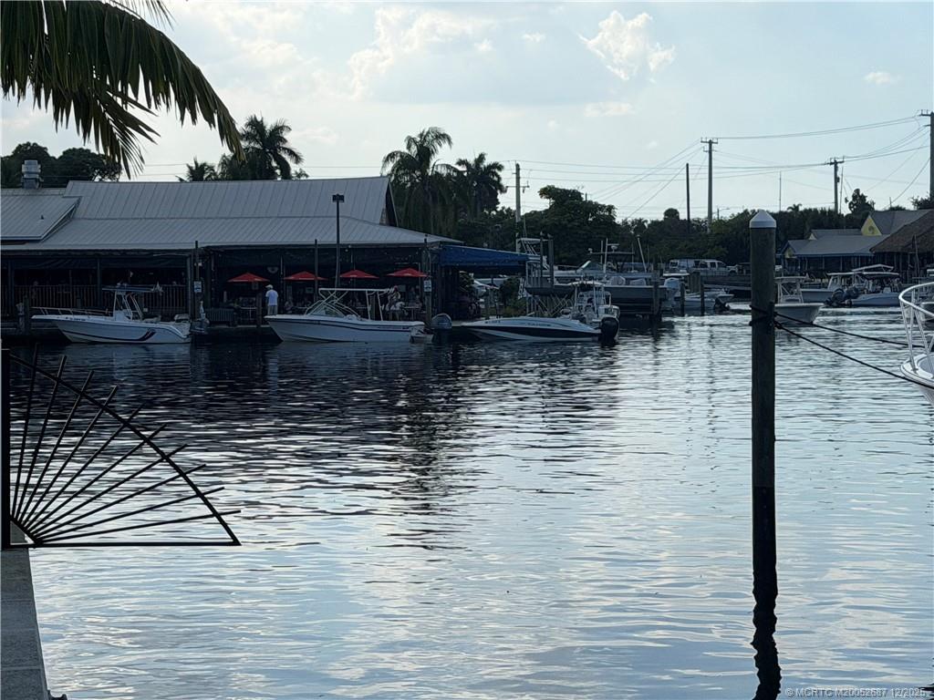 5374 Southeast Running Oak Circle Stuart, FL 34997 - Photo 36 of 38 a water pool with buildings