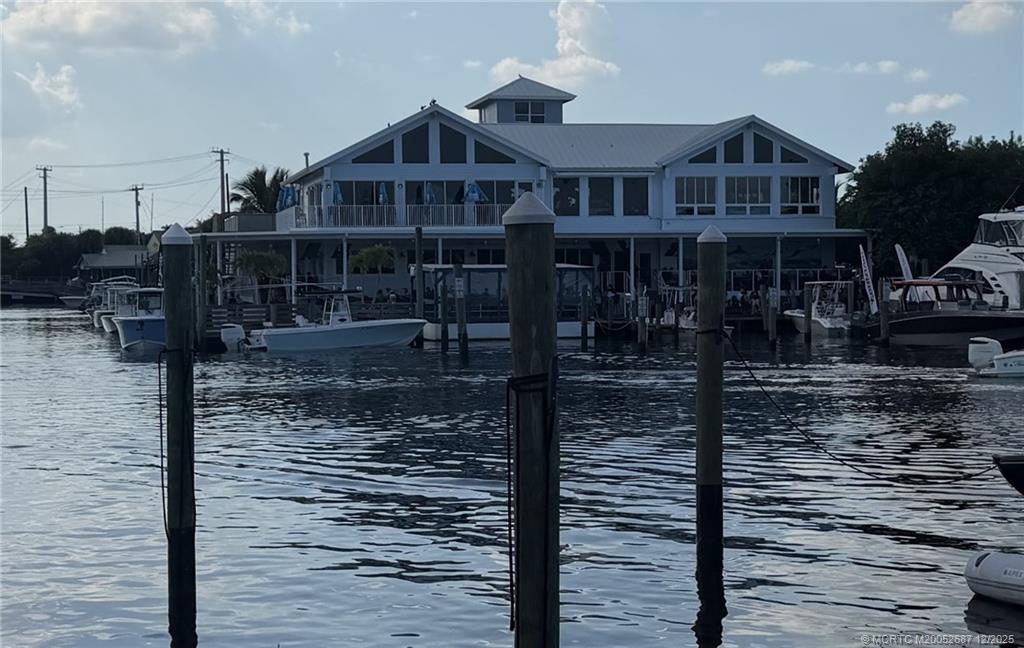 5374 Southeast Running Oak Circle Stuart, FL 34997 - Photo 37 of 38 a front view of a house with a yard