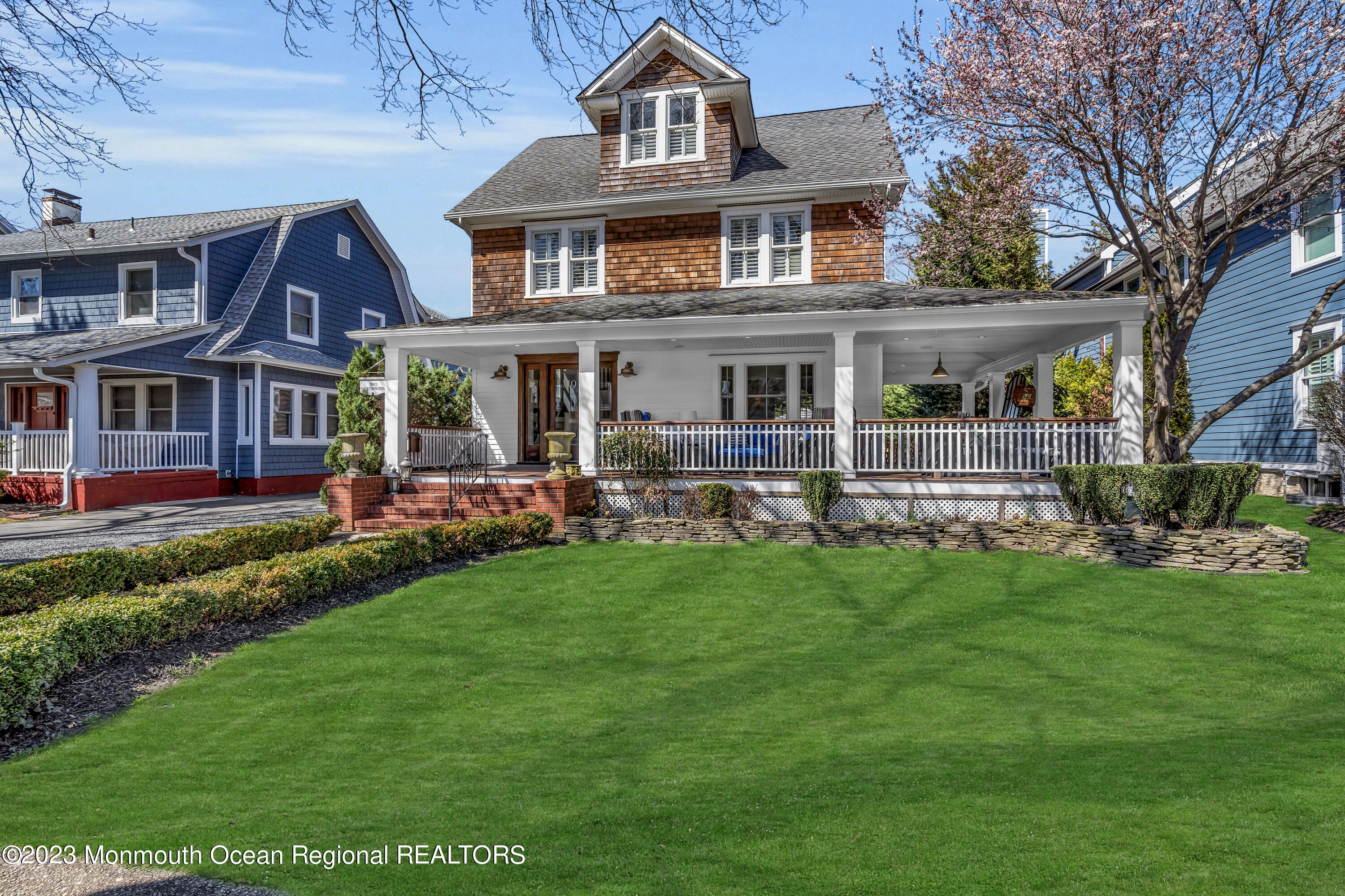 310 Worthington Avenue Spring Lake, NJ 07762 - Photo 2 of 53 a front view of a house with a garden