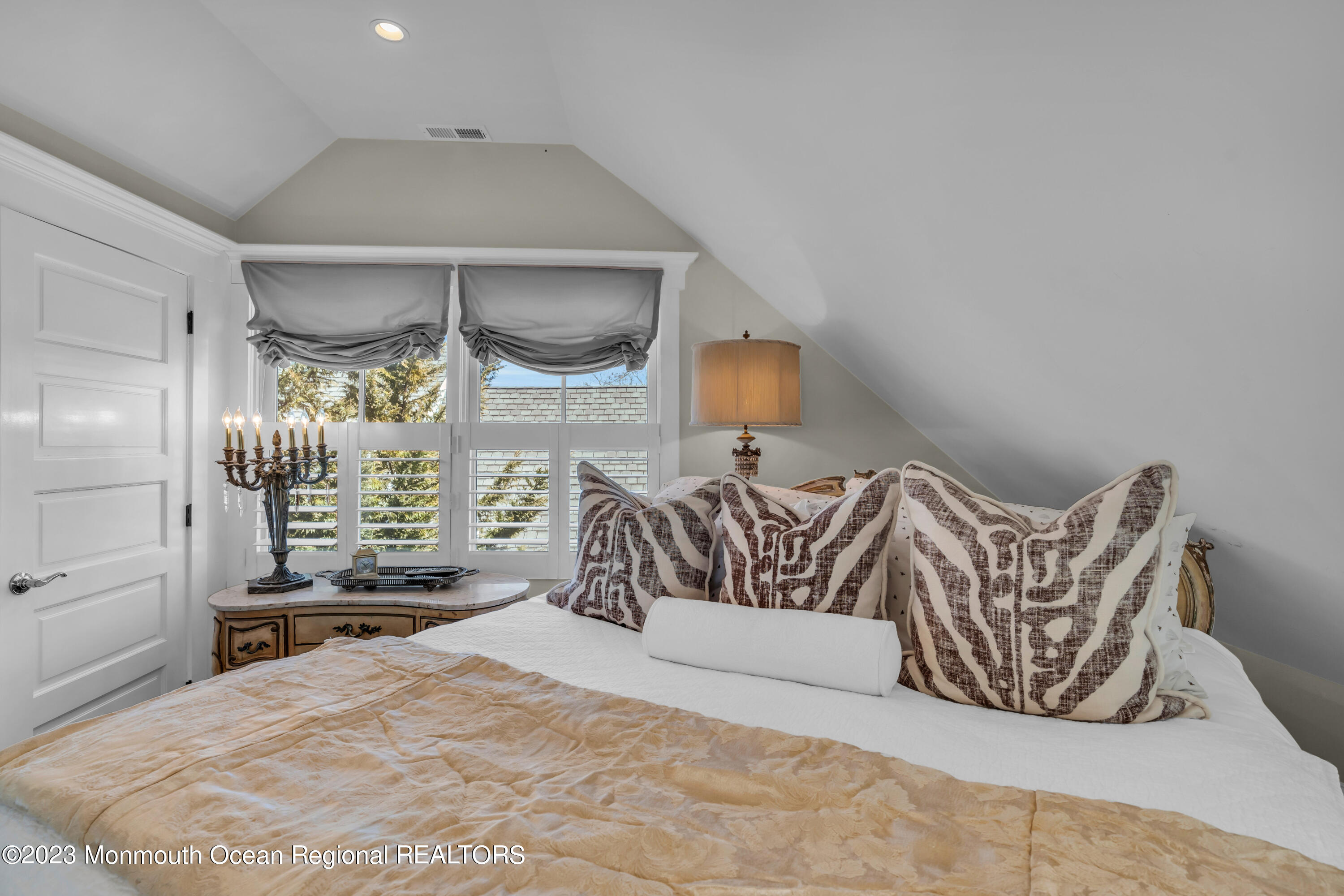 310 Worthington Avenue Spring Lake, NJ 07762 - Photo 40 of 53 a bedroom with a bed and a mirror