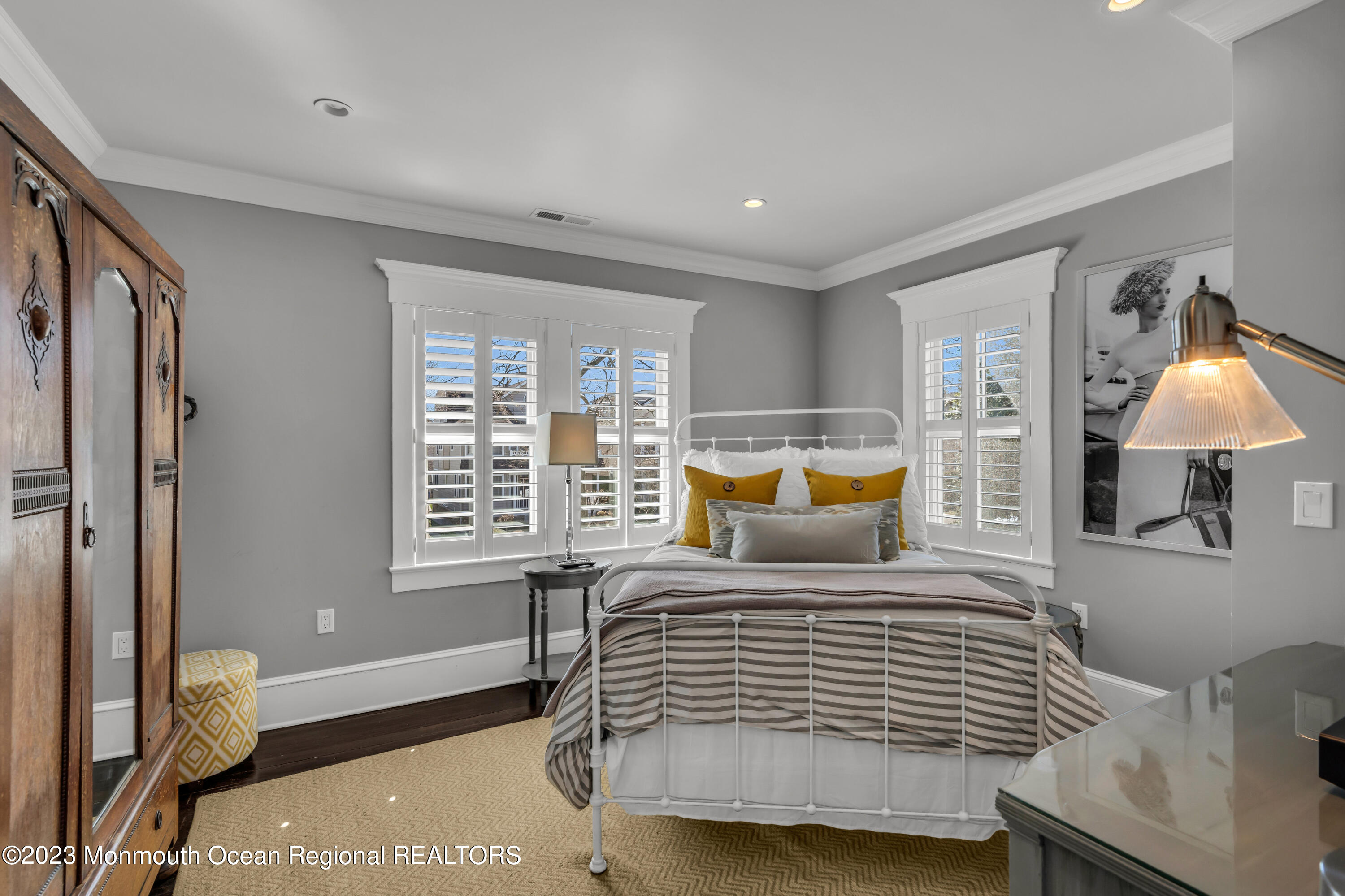 310 Worthington Avenue Spring Lake, NJ 07762 - Photo 47 of 53 a bedroom with a bed and wooden floor