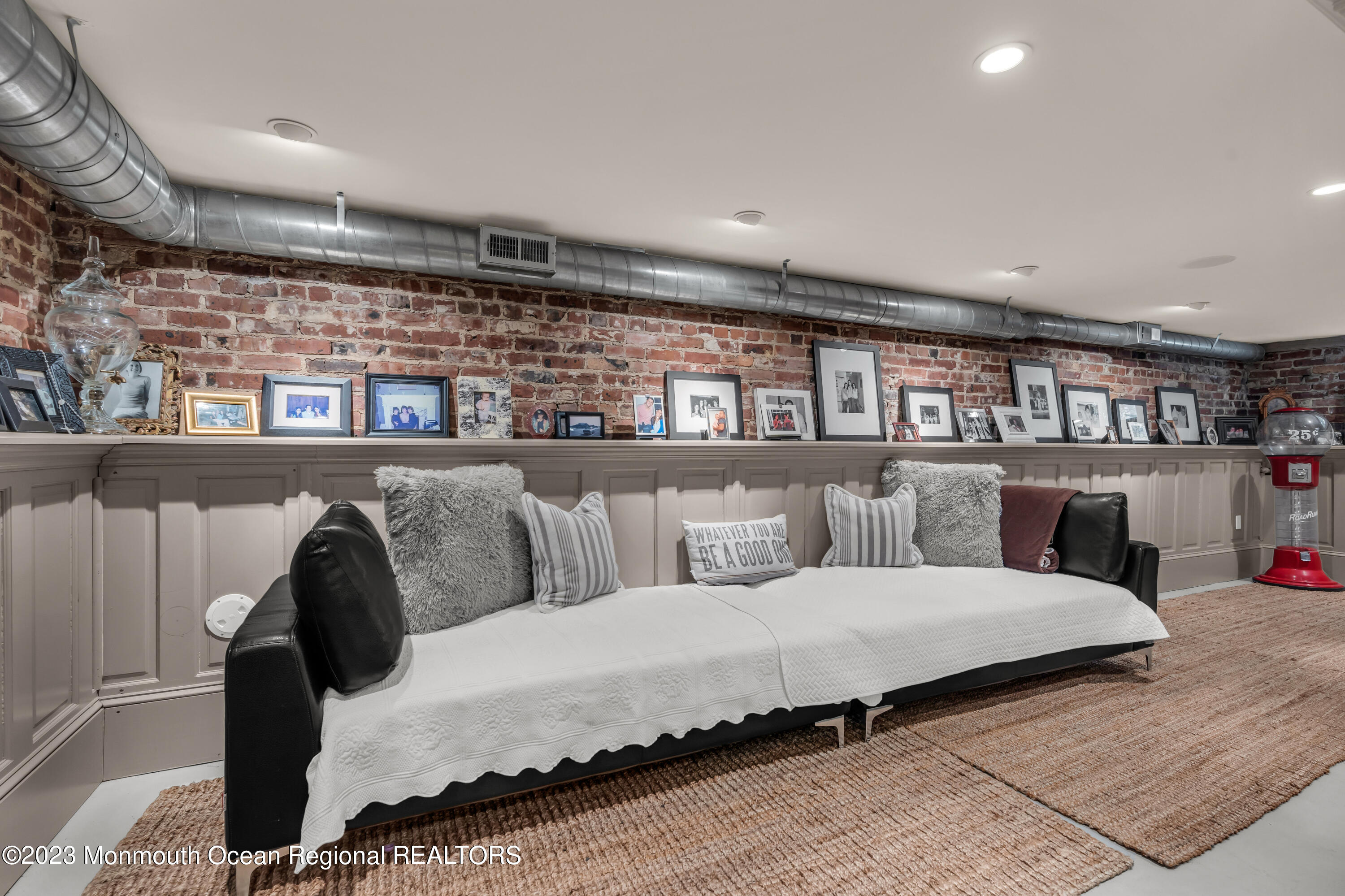 310 Worthington Avenue Spring Lake, NJ 07762 - Photo 51 of 53 a living room with furniture a rug and a book shelf