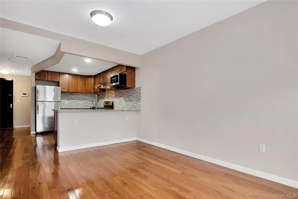 a view of kitchen with wooden floor