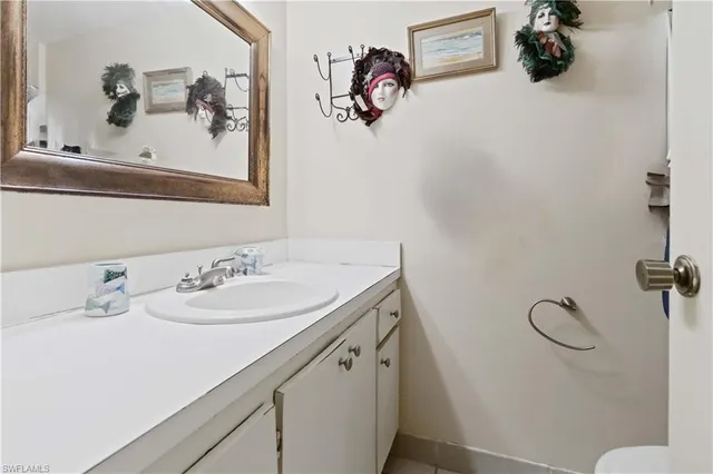 a bathroom with a sink and mirror