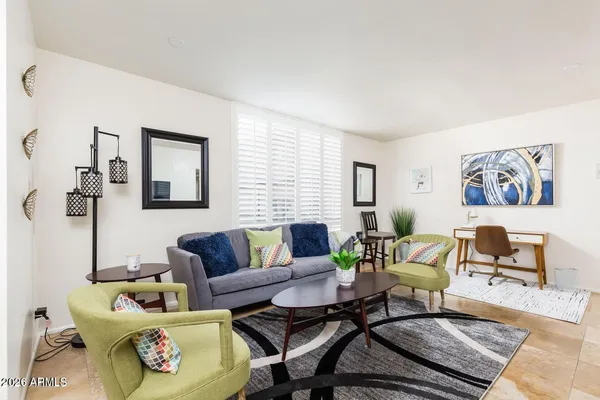 a living room with furniture and a rug