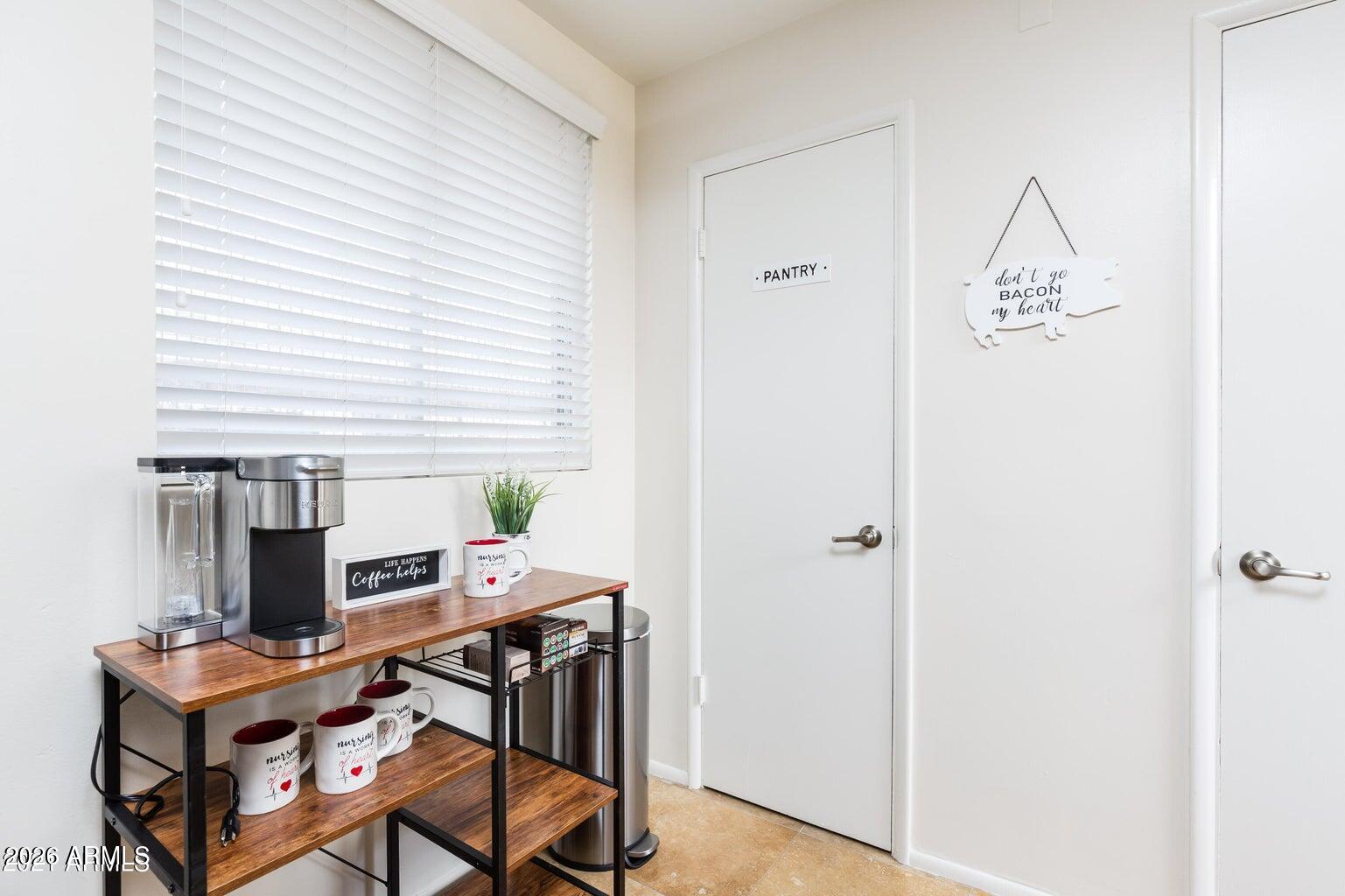 3242 East Camelback Road, Unit 104 Phoenix, AZ 85018 - Photo 12 of 19 a workspace with furniture and window