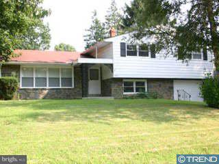 9237 Pine Road Philadelphia, PA 19115 - Photo 1 of 1 a front view of a house with a garden