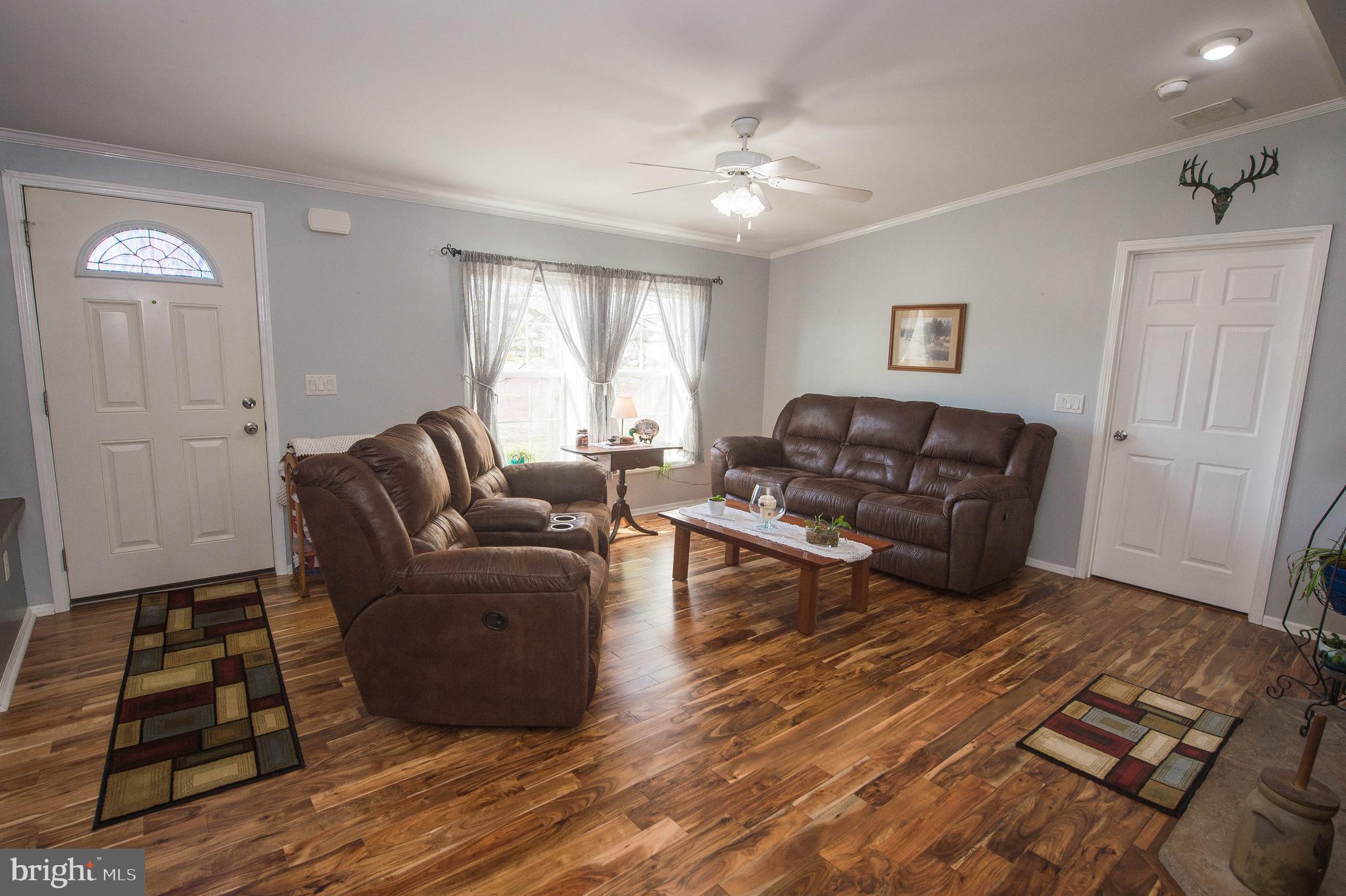 36388 Poplar Neck Road Willards, MD 21874 - Photo 16 of 34 a living room with furniture and wooden floor