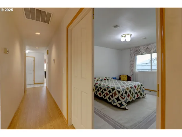 a bedroom with bed and window