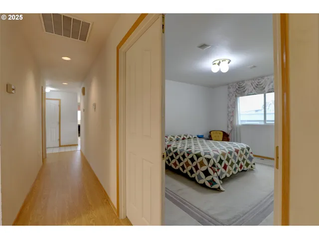 a bedroom with bed and window