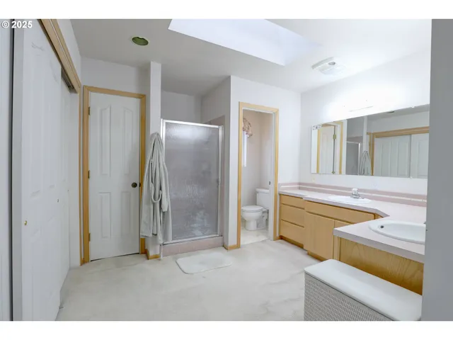 a bathroom with a tub sink and mirror