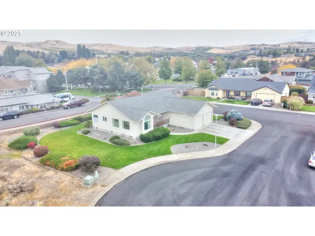 a picture of a table and chairs in the garden