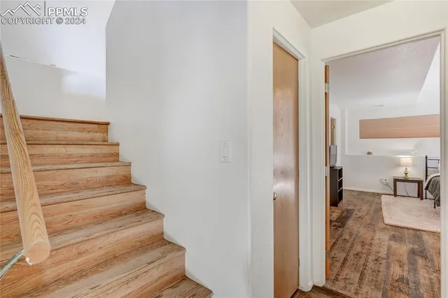 a bedroom with a bed and a table