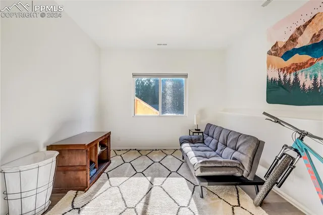 a room with furniture and air hockey table