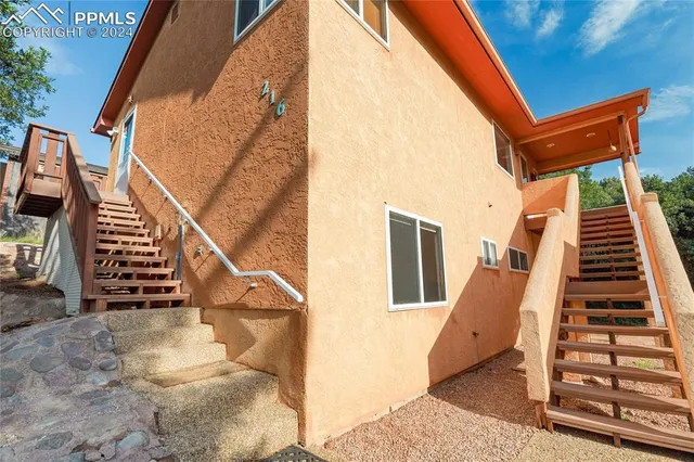 an aerial view of a house with a mountain view