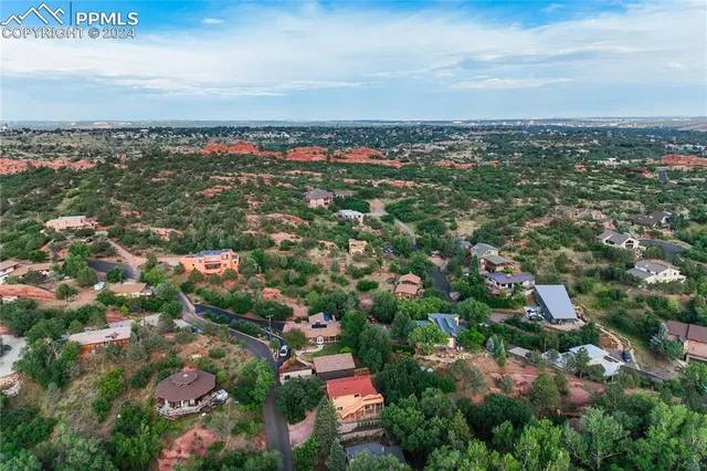 a view of a lush green hillside and houses