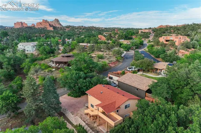 an aerial view of a house with a big yard