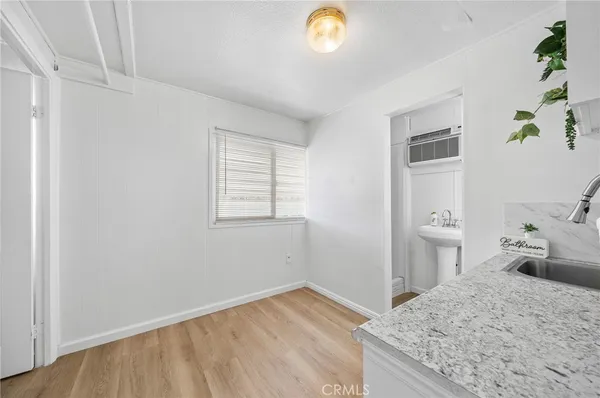 a bedroom with a bed and cabinets
