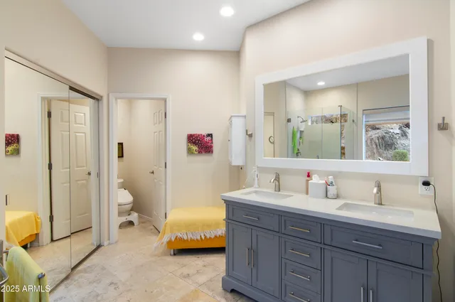 a bathroom with a tub sink and mirror