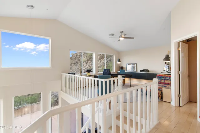 a view of a hallway with windows