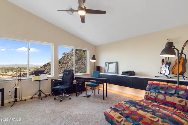 a view of a workspace with furniture and a couch