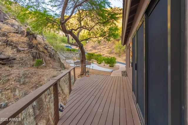 a view of balcony with wooden floor